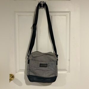 Calvin Klein grey fabric and navy blue leather trim crossbody bag